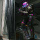 A Spartan wearing black and pink armor holds an assault rifle on the Recharge map in Halo Infinite.